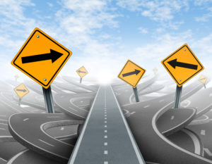 Clear strategy and solutions for business leadership symbol with a straight path to success as a journey choosing the right strategic path for business with blank yellow traffic signs cutting through a maze of tangled roads and highways.